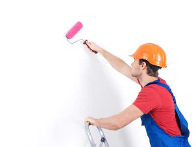 craftsman-painter-stands-stairs-with-roller-portrait-white_186202-3078